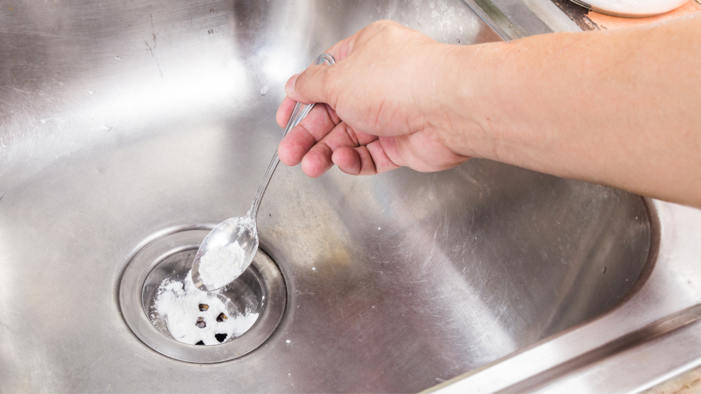 How do I clear an oil-blocked sink?