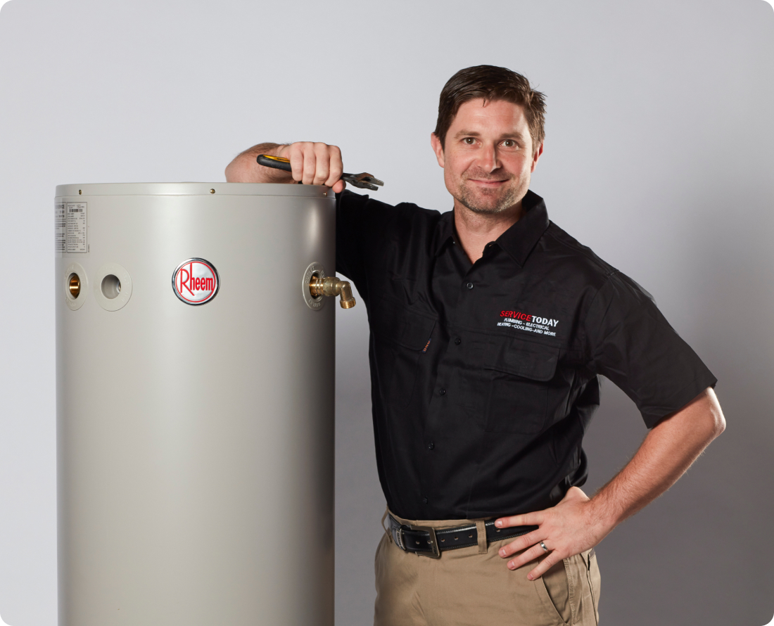 Plumber with Rheem hot water system, ready for service.