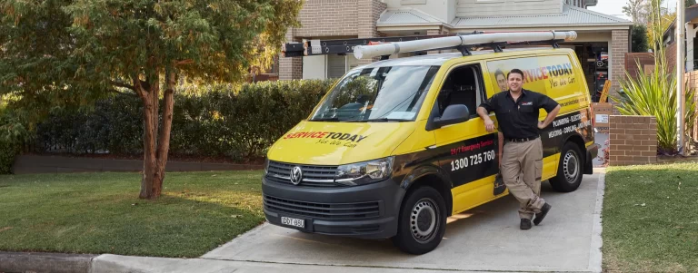 Service Today van and technician offering 24/7 emergency plumbing, electrical, and heating services.