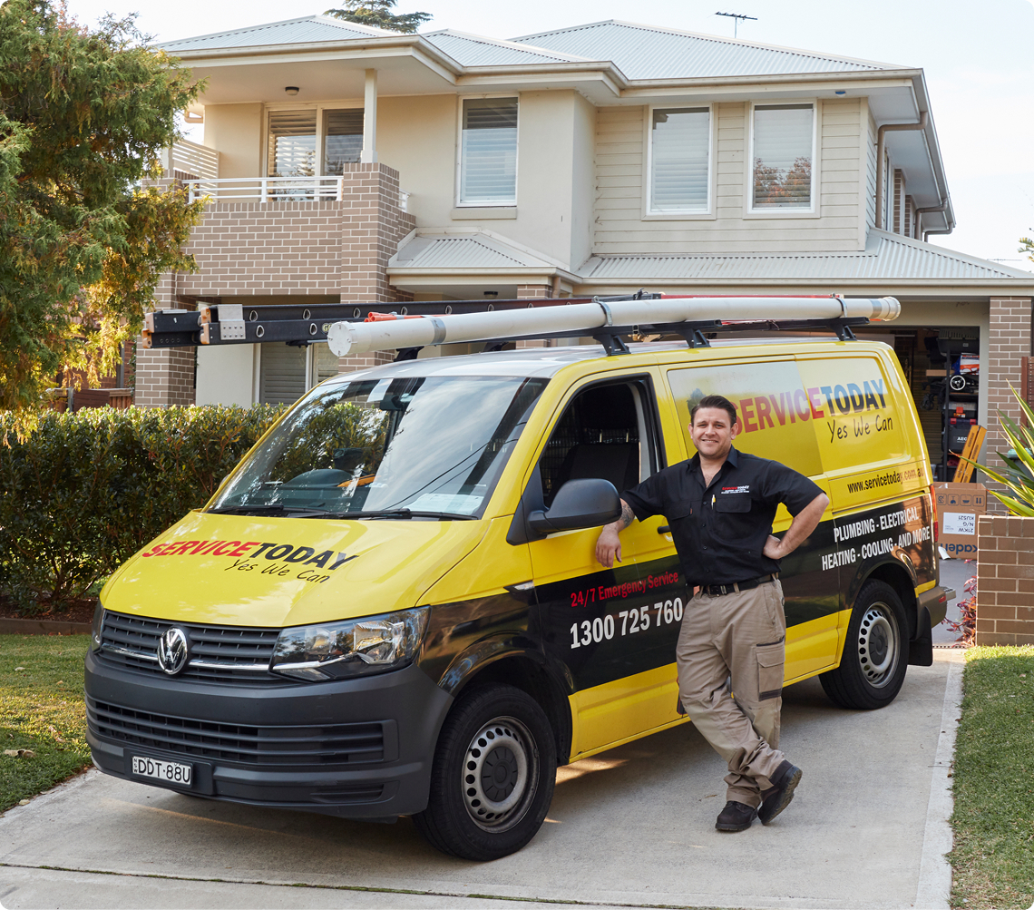 Tradesman posing with a Service Today van.